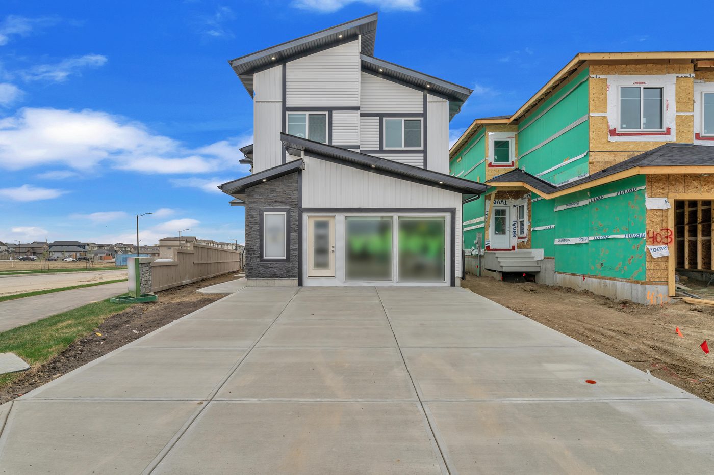 New Valley Homes show home exterior in Woodbend